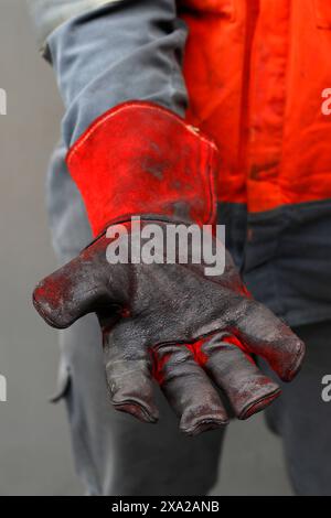 Fire proof gloves to handle dangerous substances Stock Photo