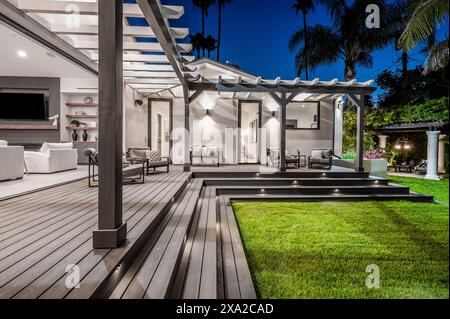 An outdoor seating area with sofas and a coffee table in a modern new construction home in Los Angeles Stock Photo