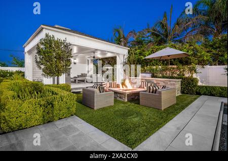 A backyard with a fire pit in a new construction home in Encino, California Stock Photo