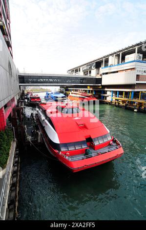 Turbojet ferries to Macau docking at the Macau ferry terminal in Sheung Wan, Hong Kong. Stock Photo