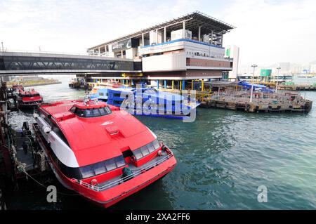 Turbojet ferries to Macau docking at the Macau ferry terminal in Sheung Wan, Hong Kong. Stock Photo