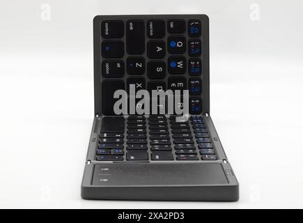Portable keyboard for laptop isolated on white background. Foldable keyboard Stock Photo