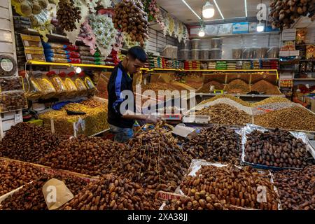 Taroudant, Morocco - 21 March, 2024: shopkeeper selling dates and figs in the souk of the medina in Taroudant Stock Photo