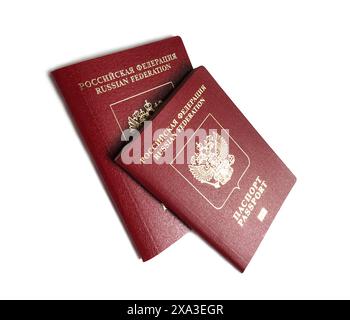 Two red russian foreign passports over white background studio shot close-up view Stock Photo