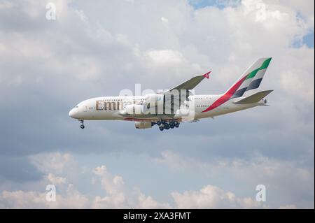 02.06.2024, Berlin, Germany, Europe - Emirates Airline Airbus A380-800 passenger aircraft with the registration A6-EVG approaches Berlin Airport BER. Stock Photo