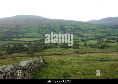 Crag Hill & Great Coum from a Dry Stone Wall Above the Village of Dent on Route to Aye Gill Pike in Dentdale, Yorkshire Dales National Park, England. Stock Photo