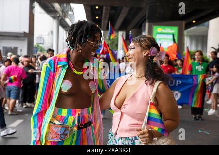 A couple kissing The Bangkok Pride Parade 2024 marked a major  