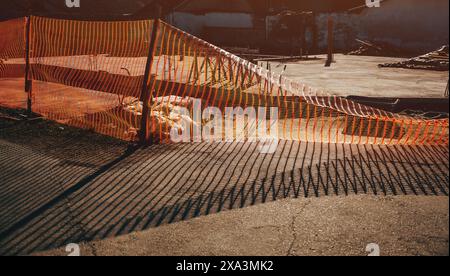 Orange barrier fencing mesh on construction site, selective focus Stock Photo