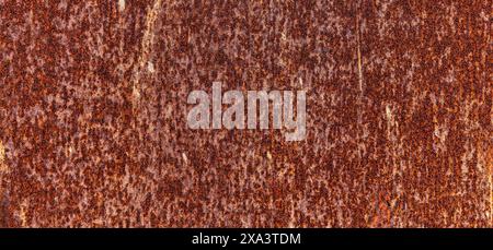 Rusty metal background image - dark pitted metal plate Stock Photo