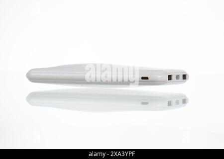 Swollen old powerbank for charger mobile phone  , isolated on white background Stock Photo