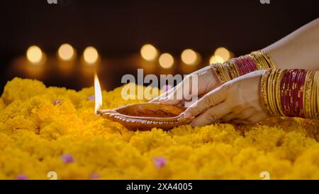 Clay diya lamps lit during diwali celebration, Diwali, or Deepavali, is a festival of lights and is one of the major festivals celebrated by Hindus, J Stock Photo