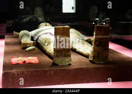 Antique Jade Clothes Sewn With Golden Thread or ancient Jade burial suit clothing in Han dynasty for use rite burial in museum for chinese people trav Stock Photo