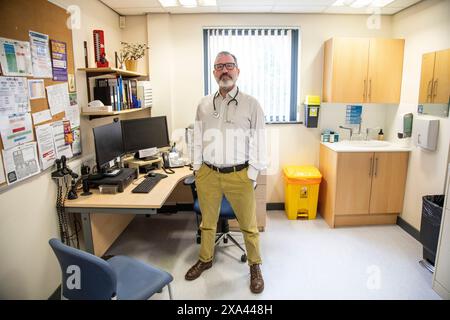 Doctor standing in a medical office Stock Photo