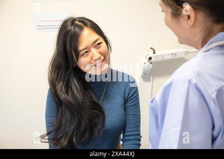 Nurse talking to a patient in a medical practice Stock Photo