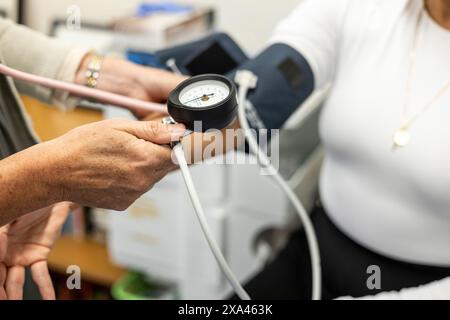Blood pressure measurement in progress Stock Photo