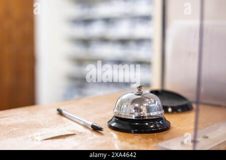 Reception desk with service bell and pen in a medical practice Stock Photo