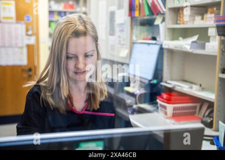 A young chemist, working in a health centre in UK Stock Photo