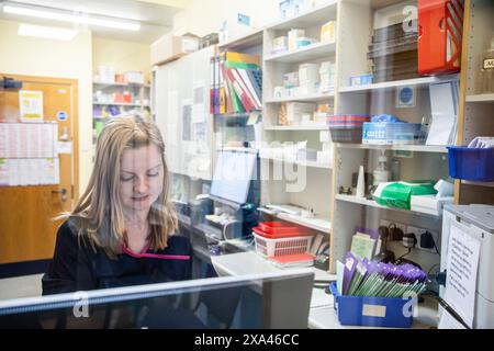 A young chemist, working in a health centre in UK Stock Photo