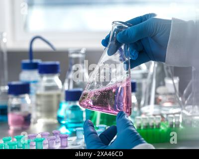 Scientist holding a flask in a laboratory Stock Photo