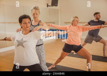 People Practicing Yoga at Yoga Studio Stock Photo