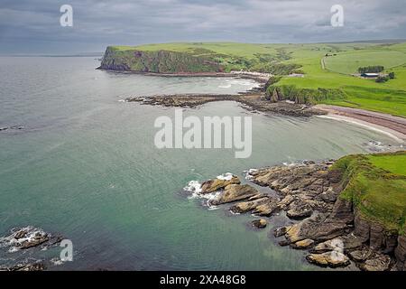 Cullykhan Beach and Bay Aberdeenshire  low tide and a view to Mill Shore Beach and Pennan village Stock Photo