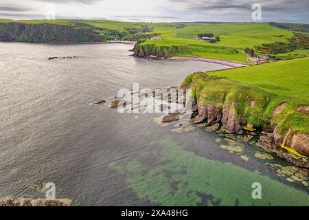 Cullykhan Beach and Bay Aberdeenshire and a view towards Mill Shore Beach and Pennan village in Spring Stock Photo