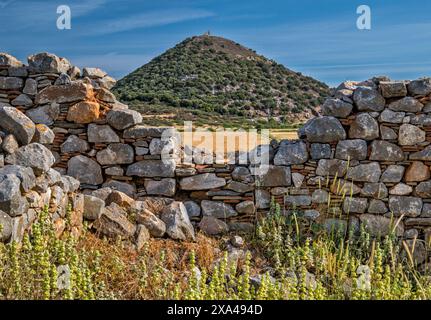 Medieval Kontostavlos farm ruins, near Dystos Lake and remnants of small Venetian fortress on hill with ruins of ancient Dystos, Evia Island, Greece Stock Photo