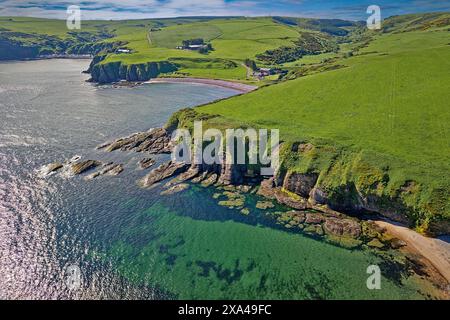 Cullykhan Beach and Bay Aberdeenshire view towards Mill Shore Beach and the houses of Pennan Stock Photo