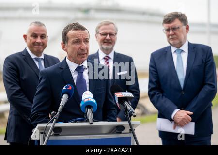 L-R Czech Industry and Trade Minister Jozef Sikela, CEO of MERO CR Jaroslav Pantucek, Prime Minister Petr Fiala and Finance Minister Zbynek Stanjura give the press conference on expansion of Italian TAL pipeline, in Nelahozeves, Czech Republic, on June 4, 2024. Czechia will get rid of its dependence on Russian oil by the middle of next year at the latest, PM Fiala said, adding that he wants to request the end of the exemption on Russian oil imports as soon as the TAL pipeline expansion project is completed. (CTK Photo/Ondrej Deml) Stock Photo