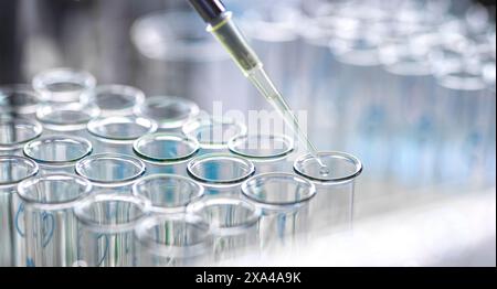 [various]Pharmaceutical Research, scientist pipetting sample into a test tube during an experiment in the lab. Stock Photo