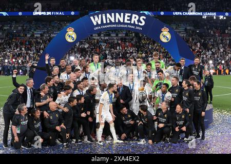 London, UK. 1st June, 2024. Real Madrdid players and staff celebrate with the trophy following the 2-0 victory in the UEFA Champions League match at Wembley Stadium, London. Picture credit should read: Jonathan Moscrop/Sportimage Credit: Sportimage Ltd/Alamy Live News Stock Photo