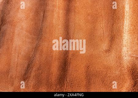 Orange leather texture background, useful as background. Orange matte suede fabric background, close-up. High quality photo Stock Photo