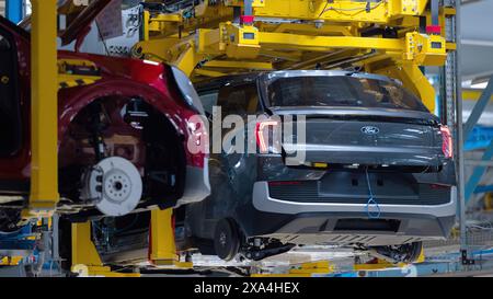 Cologne, Germany. 04th June, 2024. Ford Explorer electric cars stand in the hall at the start of production. It is the first electric car from Ford in Europe. Around two billion euros have been invested in the Cologne production site. Credit: Rolf Vennenbernd/dpa/Alamy Live News Stock Photo