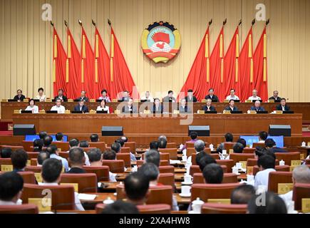 (240604) -- BEIJING, June 4, 2024 (Xinhua) -- The seventh meeting of the Standing Committee of the 14th National Committee of the Chinese People's Political Consultative Conference (CPPCC) opens in Beijing, capital of China, June 4, 2024, focusing on building a high-level socialist market economy system. Wang Huning, a member of the Standing Committee of the Political Bureau of the Communist Party of China (CPC) Central Committee and chairman of the CPPCC National Committee, presided over the opening meeting. Ding Xuexiang, a member of the Standing Committee of the Political Bureau of the CP Stock Photo