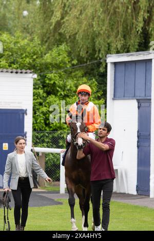 Windsor, UK. 3rd June, 2024. Horse Rajeko ridden by jockey Oisin Murphy (orange silks) winner of the British Stallion Studs EBF Novice Stakes at Royal Windsor Racecourse in Windsor, Berkshire at the 80s Retro Explosion Monday Evening Races. Owner Jester Ltd, M Khan and Partner, Trainer Michael Bell, Newmarket, Breeder Phillistown House, Sponsor Michael Bell Racing. Credit: Maureen McLean/Alamy Live News Stock Photo