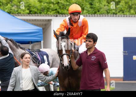 Windsor, UK. 3rd June, 2024. Horse Rajeko ridden by jockey Oisin Murphy (orange silks) winner of the British Stallion Studs EBF Novice Stakes at Royal Windsor Racecourse in Windsor, Berkshire at the 80s Retro Explosion Monday Evening Races. Owner Jester Ltd, M Khan and Partner, Trainer Michael Bell, Newmarket, Breeder Phillistown House, Sponsor Michael Bell Racing. Credit: Maureen McLean/Alamy Live News Stock Photo