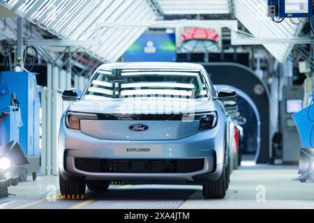 Cologne, Germany. 04th June, 2024. Ford Explorer electric cars stand in the hall at the start of production. It is the first electric car from Ford in Europe. Around two billion euros have been invested in the Cologne production site. Credit: Rolf Vennenbernd/dpa/Alamy Live News Stock Photo