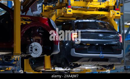 Cologne, Germany. 04th June, 2024. Ford Explorer electric cars stand in the hall at the start of production. It is the first electric car from Ford in Europe. Around two billion euros have been invested in the Cologne production site. Credit: Rolf Vennenbernd/dpa/Alamy Live News Stock Photo