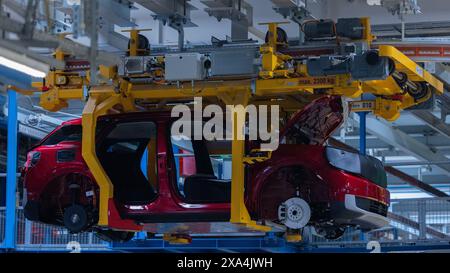 Cologne, Germany. 04th June, 2024. Ford Explorer electric cars stand in the hall at the start of production. It is the first electric car from Ford in Europe. Around two billion euros have been invested in the Cologne production site. Credit: Rolf Vennenbernd/dpa/Alamy Live News Stock Photo