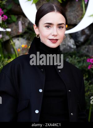 Lily Collins attends the Dior Cruise 2025 show at Drummond Castle