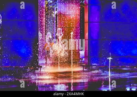 Water,light.Glowing multi colored decorative fountains Stock Photo