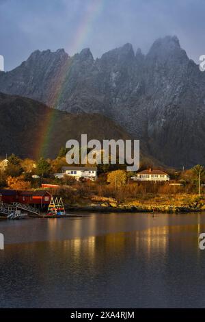 Mountains and rainbow from Ballstad harbour during sunrise, Vestvagoy, Nordland, Lofoten Islands, Norway, Europe Copyright: carloxalbertoxconti 1369-1 Stock Photo