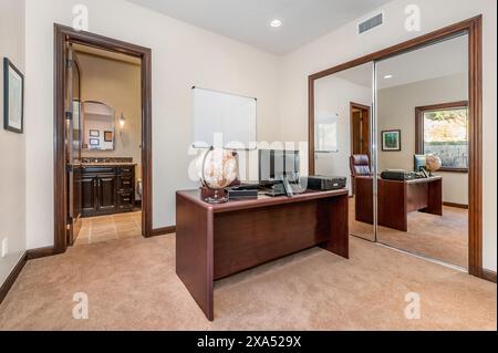 Brightly lit office space with carpet flooring Stock Photo