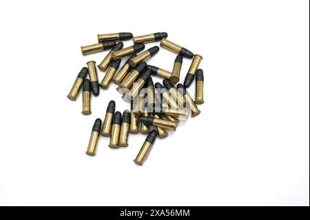 A handful of standard .22 caliber bullets on a white background. .22 LR Long Rifle. Small caliber for light and sporting weapons Stock Photo