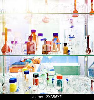 Laboratory glass dishes, bottles, jars and flasks in store Stock Photo