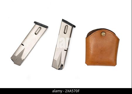 Detail of a leather holster and two magazines for a 9mm parabellum LLama semi-automatic pistol on a white background Stock Photo