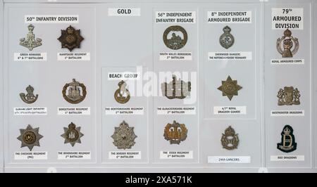 Detail of medals and badges from the second world war D-Day British cap badges Stock Photo