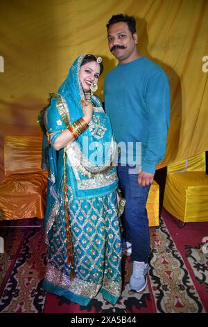 A couple posing for a photo on a carpet Stock Photo