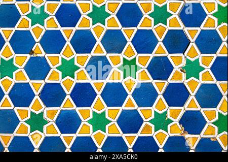 Vintage cracked tile with geometric arabic pattern on the mosque wall as texture or background Stock Photo
