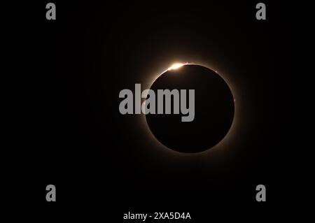 A total solar eclipse in the sky with full coverage of the sun Stock Photo
